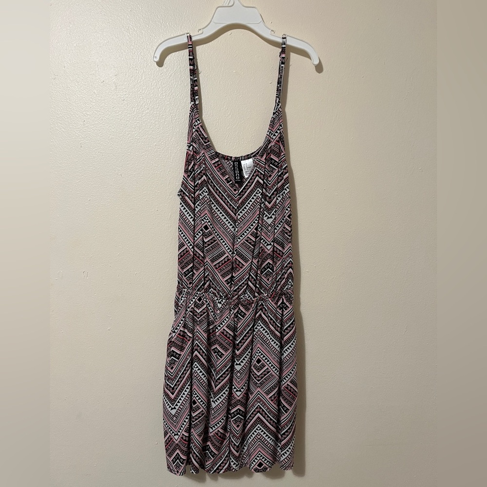 Pink and black tribal print H&M romper with adjustable straps.